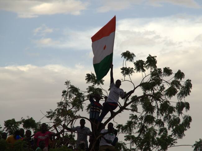 NIAMEY, NIGER - OCTOBER 01: Bakary Yaou Sangare (not seen), who was made foreign minister after the coup, gives a speech during a protest held outside the French military base urging the withdrawal of French troops from Niger on October 01, 2023. (Photo by Balima Boureima/Anadolu Agency via Getty Images)