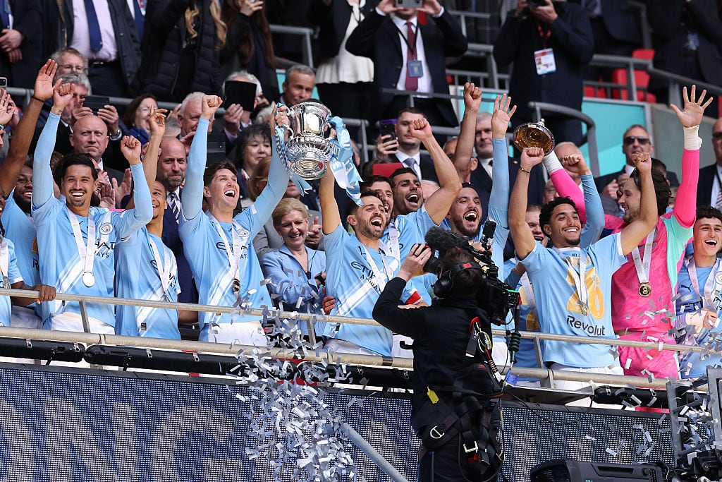 LONDON, ENGLAND - MAY 16: Bernardo Silva of Manchester City and teammates celebrates with the FA Cup trophy after the Emirates FA Cup Final match between Chelsea and Manchester City on May 16, 2026 in London, England. (Photo by Alex Livesey - Danehouse/Getty Images)