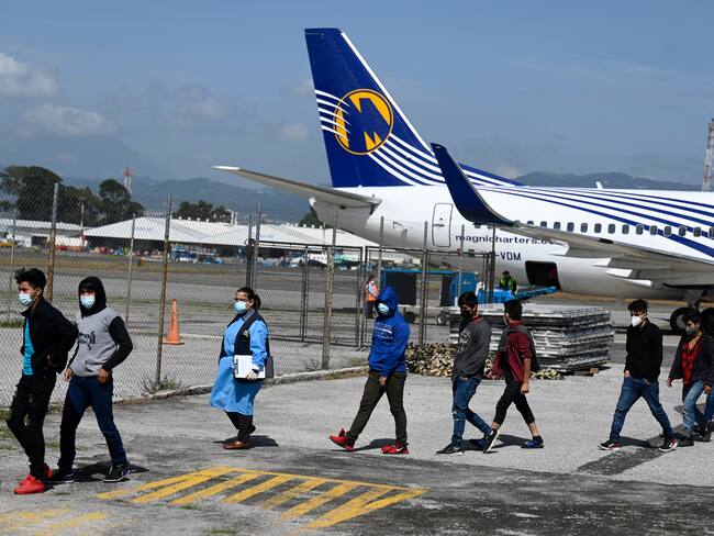 Part of a group of 136 Guatemalans deported from San Luis Potosi state, Mexico walk upon their arrival at the Air Force Base in Guatemala City on August 26, 2021. - Mexican migration authorities deported 136 Guatemalan migrants, including 61 unaccompanied minors on Thursday, according to a report by the Guatemalan Migration Institute. (Photo by Johan ORDONEZ / AFP) (Photo by JOHAN ORDONEZ/AFP via Getty Images)