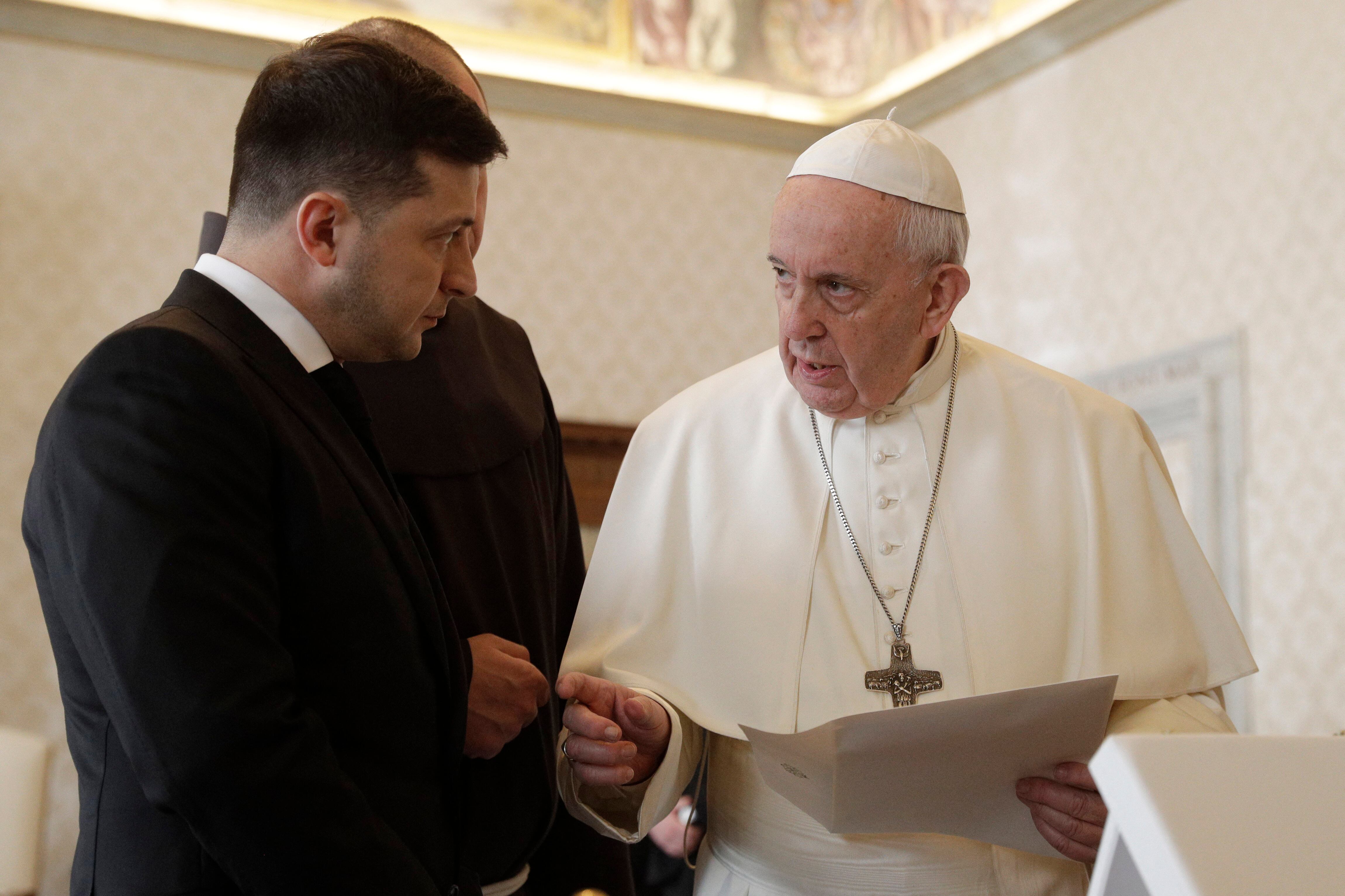 Pope Francis exchanges gift with Ukrainian President Volodymyr Zelensky (L) during a private audience at the Vatican on February 8, 2020. (Photo by Gregorio Borgia / POOL / AFP)