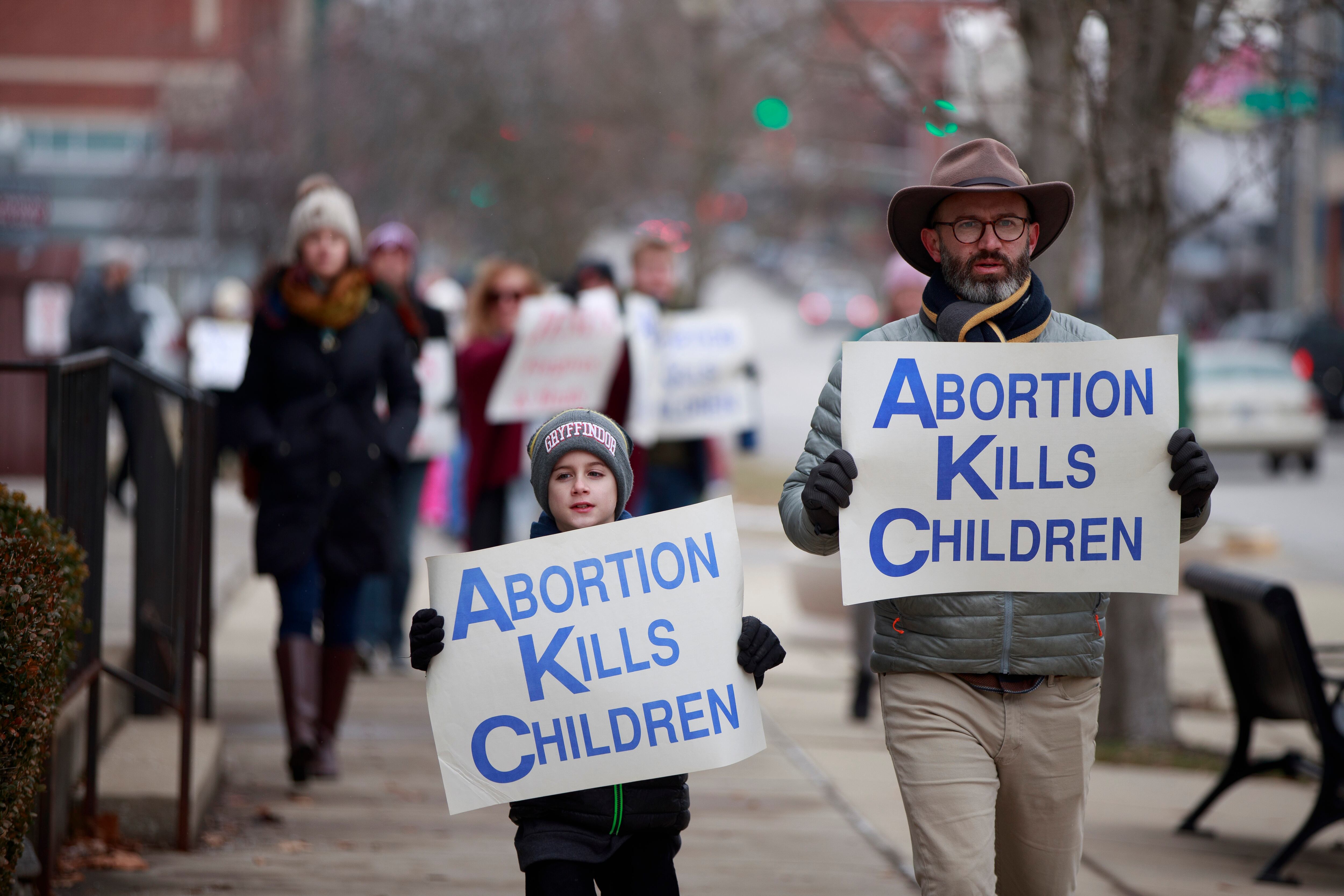 BLOOMINGTON, UNITED STATES - 2022/01/23: Anti-abortion protesters march from the Monroe County Courthouse around Planned Parenthood and back to the courthouse during the Rally for Life in Bloomington. Indiana lawmakers are considering a law that would make it a felony to coerce a pregnant woman into having an abortion. The Supreme Court of the United States is also expected to hear cases that could overturn Roe v.s. Wade, a 1973 ruling that made abortion legal under the U.S. Constitution. (Photo by Jeremy Hogan/SOPA Images/LightRocket via Getty Images)