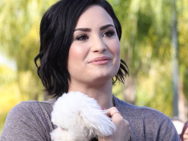 Demi Lovato con su perro Buddy, que murió el pasado mes de julio.