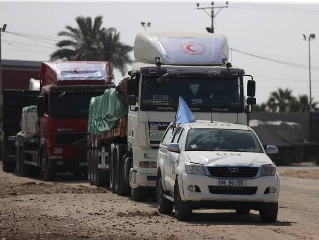 RAFAH, GAZA - OCTOBER 21: UN relief agency for Palestine refugees, UNRWA, receives the humanitarian aid brought by first convoy of relief trucks from Egyptian side, at Rafah border in Rafah, Gaza on October 21, 2023. UN agency is expected to deliver humanitarian aid to those in need in various areas of the strip, Gaza government media office said on Saturday. (Photo by Mustafa Hassona/Anadolu via Getty Images)