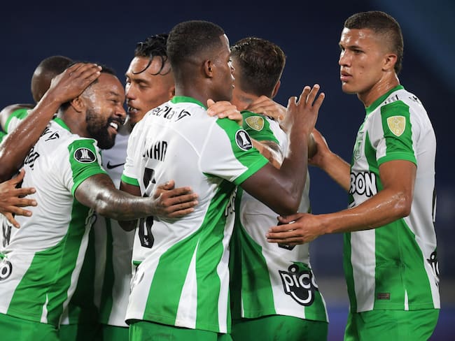 Atletico Nacional&#039;s midfielder Dorlan Pabon (L) celebrates with teammates after scoring against Melgar during the Copa Libertadores group stage first leg football match between Atletico Nacional and Melgar at the Metropolitan stadium in Barranquilla, Colombia, on April 20, 2023. (Photo by Daniel MUNOZ / AFP) (Photo by DANIEL MUNOZ/AFP via Getty Images)