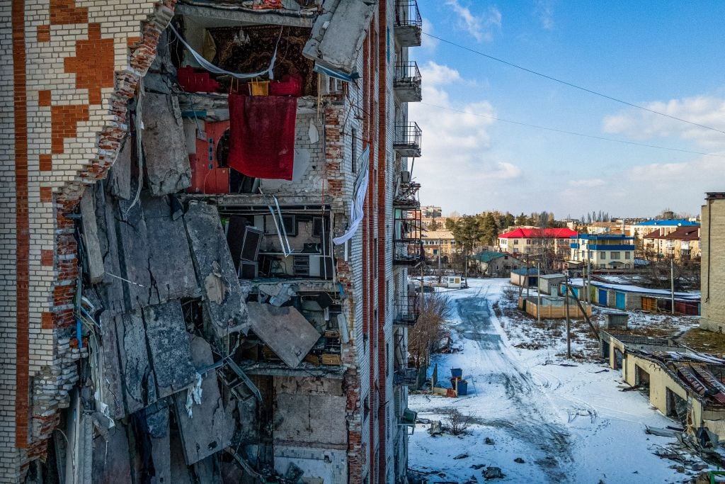 This aerial photograph shows a damaged residential building in the town of Lyman, Donetsk region, on February 22, 2023, amid Russia's military invasion on Ukraine. (Photo by Ihor TKACHOV / AFP) (Photo by IHOR TKACHOV/AFP via Getty Images)