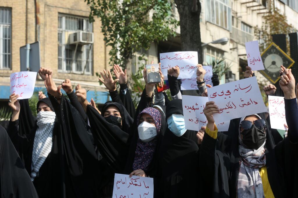 TEHRAN, IRAN - OCTOBER 27: Pro-regime protesters, mostly students, gather outside the British Embassy to stage a demonstration condemning "the United Kingdom's support of anti-government protests in Iran and Iranian opposition television stations broadcasting from London" in Tehran, Iran on October 27, 2022. (Photo by Fatemeh Bahrami/Anadolu Agency via Getty Images)