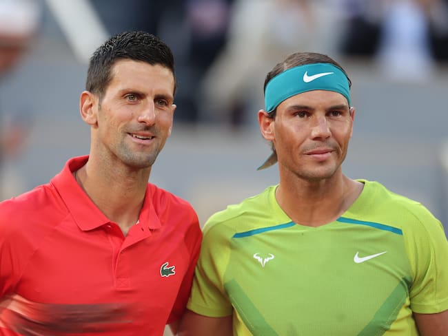PARIS, FRANCE May 31. Novak Djokovic of Serbia and  Rafael Nadal of Spain pose for a photograph at the net before theit match on Court Philippe Chatrier during the singles Quarter Final match at the 2022 French Open Tennis Tournament at Roland Garros on May 31st 2022 in Paris, France. (Photo by Tim Clayton/Corbis via Getty Images)