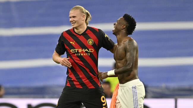 MADRID, SPAIN - MAY 09: Vinicius Junior (R) of Real Madrid and Erling Haaland (L) of Manchester City greet each other after the UEFA Champions League semi-final match between Real Madrid and Manchester City at Santiago Bernabeu Stadium in Madrid, Spain on May 09, 2023. (Photo by Burak Akbulut/Anadolu Agency via Getty Images)