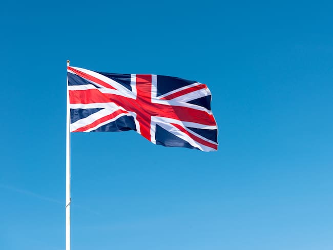 Union Jack Flag of Great Britain against a Blue Sky