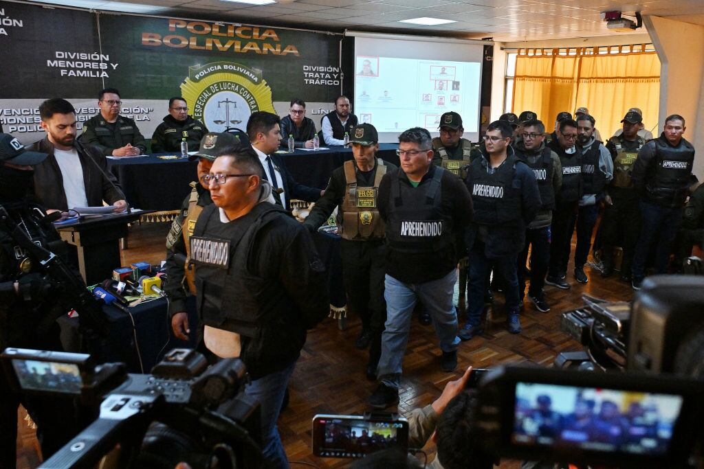Military Mario Mauricio Cabiedes, Waldir Mamani Higalgo, Luis Domingo Balanza, Miguel fernando Iriarte, Leonel Elio Sanjines, Julio Omar Buitrago and Roman Caba Cosio are escorted by policemen following their arrest, accused of being accomplices of now-dismissed army chief General Juan Jose Zuniga, after he led a military movement that attempted to seize the government palace by force in La Paz on June 27, 2024. . Bolivian President Luis Arce was facing a deep political crisis on Thursday after a botched bid by military chiefs to overthrow his government deepened turmoil in a country facing severe economic decline. (Photo by AIZAR RALDES / AFP) (Photo by AIZAR RALDES/AFP via Getty Images)