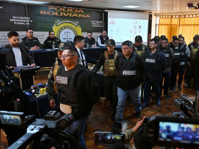 Military Mario Mauricio Cabiedes, Waldir Mamani Higalgo, Luis Domingo Balanza, Miguel fernando Iriarte, Leonel Elio Sanjines, Julio Omar Buitrago and Roman Caba Cosio are escorted by policemen following their arrest, accused of being accomplices of now-dismissed army chief General Juan Jose Zuniga, after he led a military movement that attempted to seize the government palace by force in La Paz on June 27, 2024.  . Bolivian President Luis Arce was facing a deep political crisis on Thursday after a botched bid by military chiefs to overthrow his government deepened turmoil in a country facing severe economic decline. (Photo by AIZAR RALDES / AFP) (Photo by AIZAR RALDES/AFP via Getty Images)