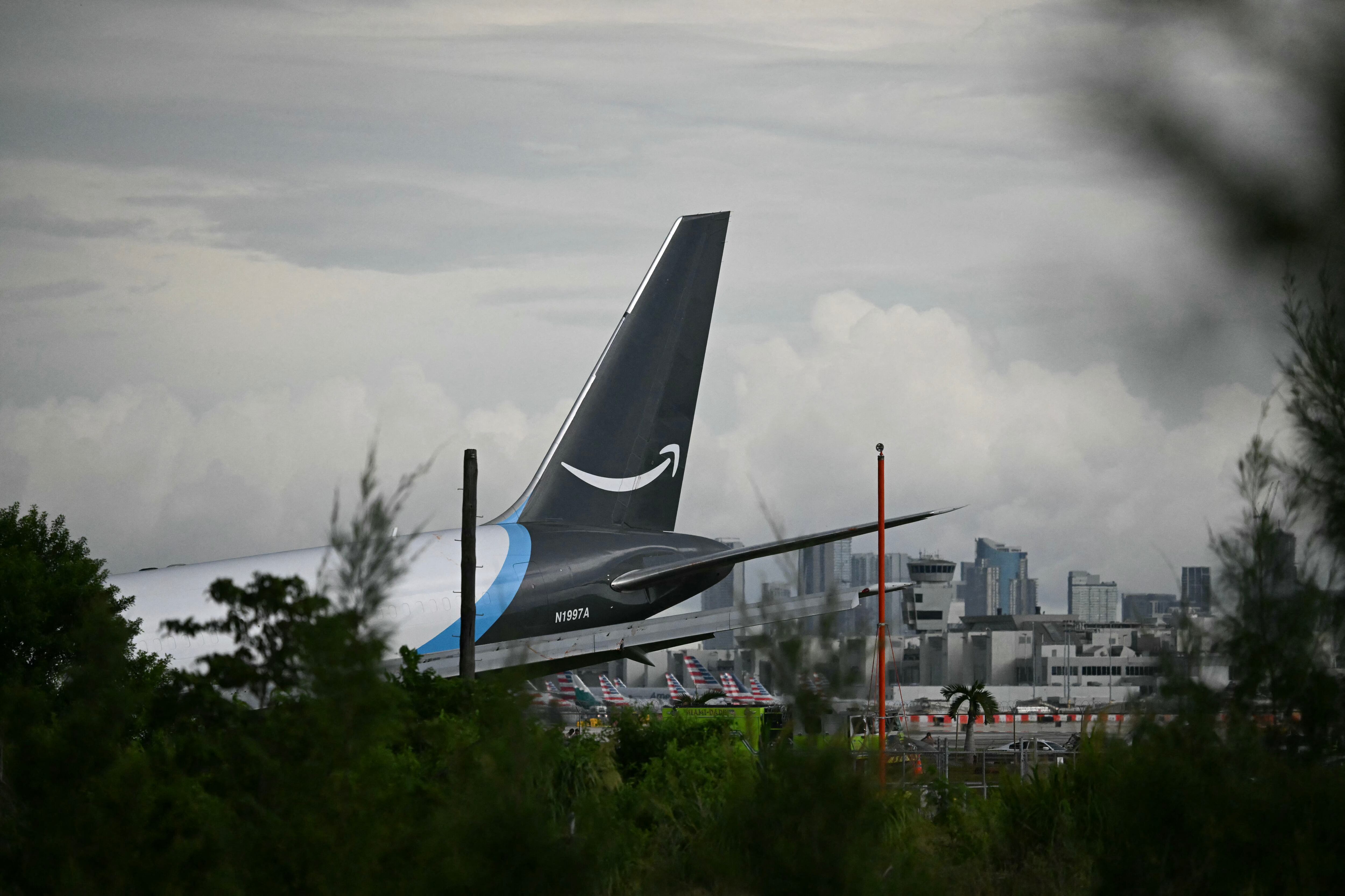 The tail section of a cargo plane is seen at Miami International Airport after it overran the runway at Miami International Airport in Miami, Florida, on September 6, 2026. (Photo by CHANDAN KHANNA / AFP)