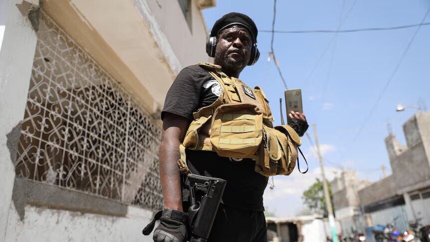 Former police officer Jimmy "Barbecue" Cherizier is a leader of an alliance of armed groups in Haiti.(Reuters: Ralph Tedy Erol)