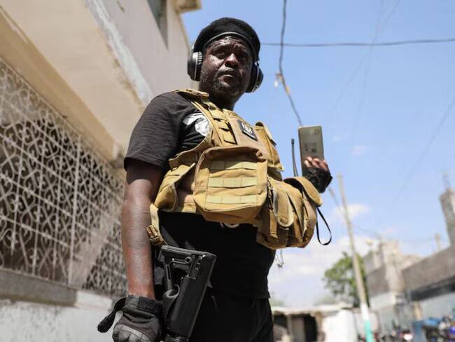 Former police officer Jimmy "Barbecue" Cherizier is a leader of an alliance of armed groups in Haiti.(Reuters: Ralph Tedy Erol)