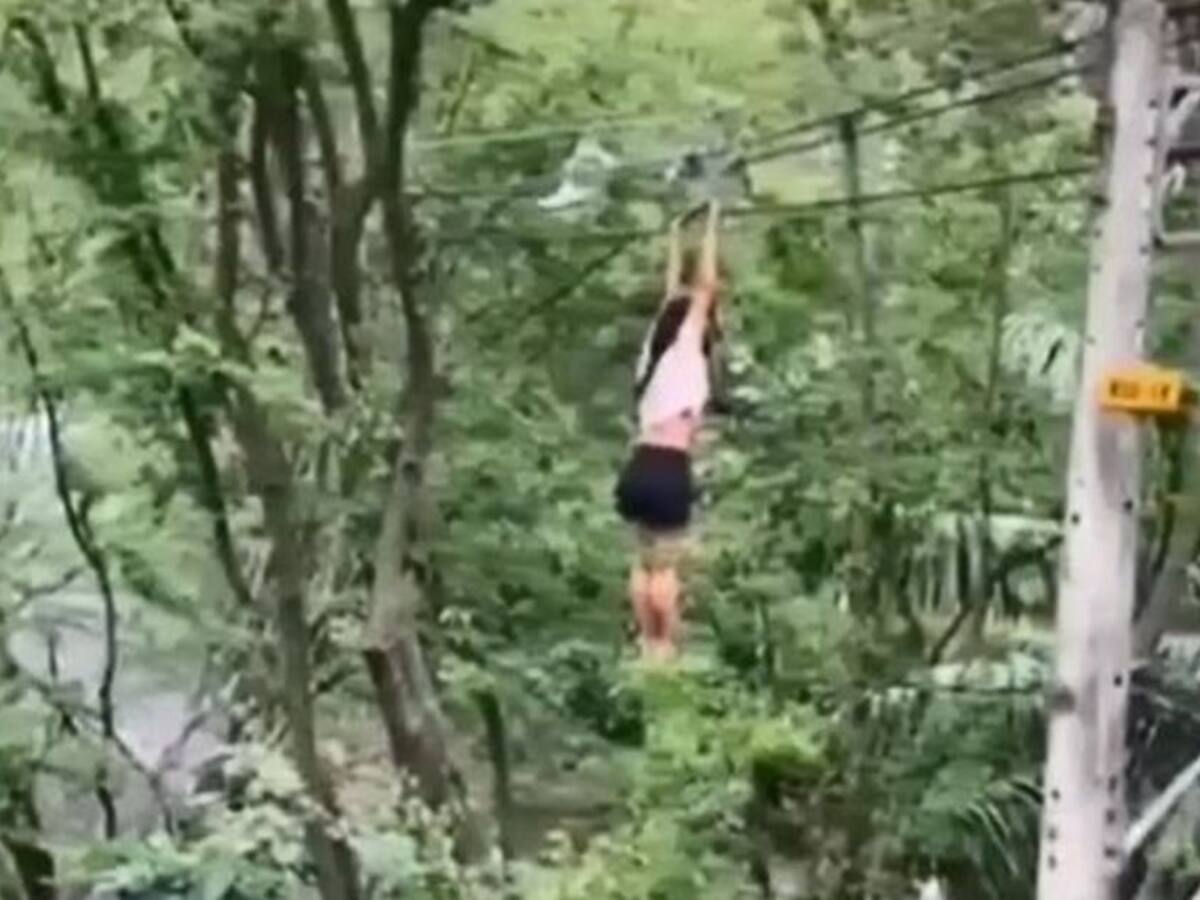 Aparatosa caída de una mujer que se colgó de cables de energía en Medellín