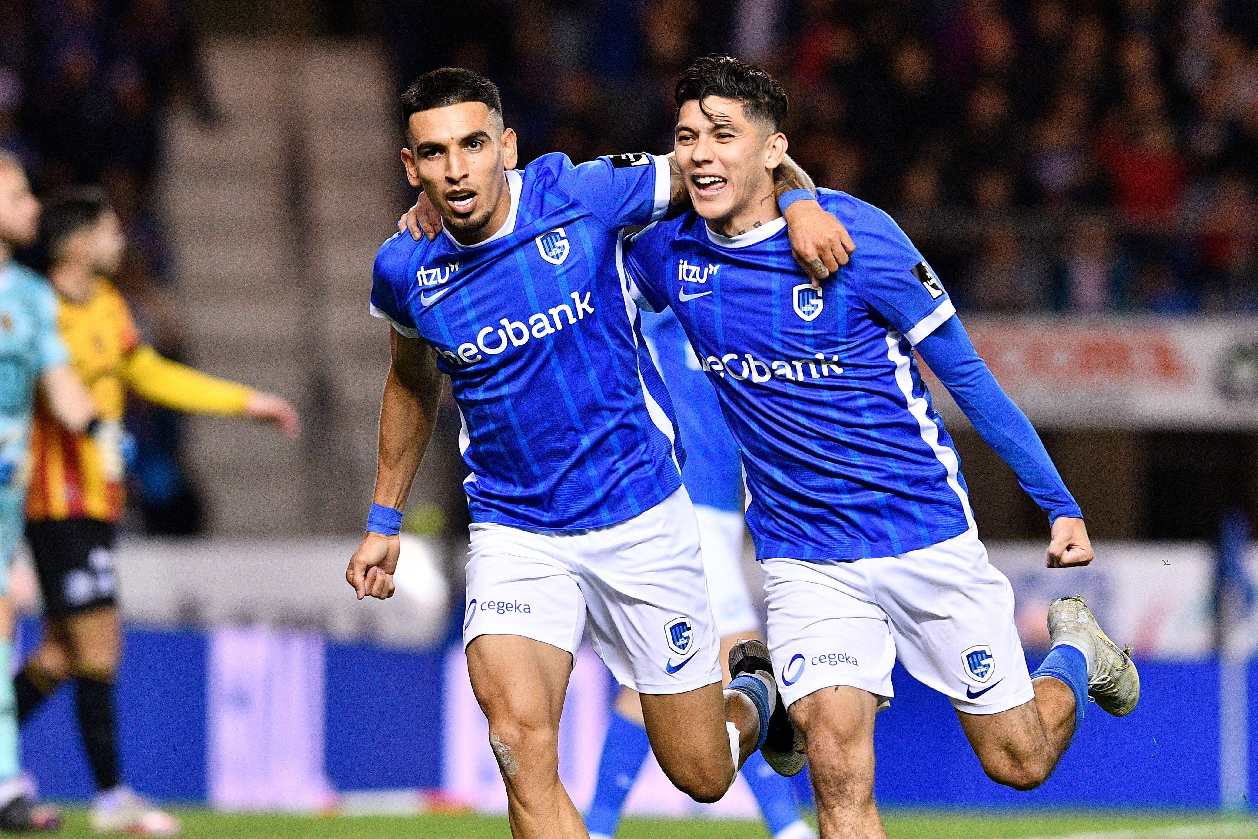 Genk's Mexican defender Gerardo Arteaga (R) celebrates scoring his team's second goal with teammate Genk's Colombian defender Daniel Munoz during the Belgian Pro League first division football match between KRC Genk and KV Mechelen at The Cegeka Arena stadium in Genk on October 28, 2022. - Belgium OUT (Photo by JOHAN EYCKENS / BELGA / AFP) / Belgium OUT (Photo by JOHAN EYCKENS/BELGA/AFP via Getty Images)