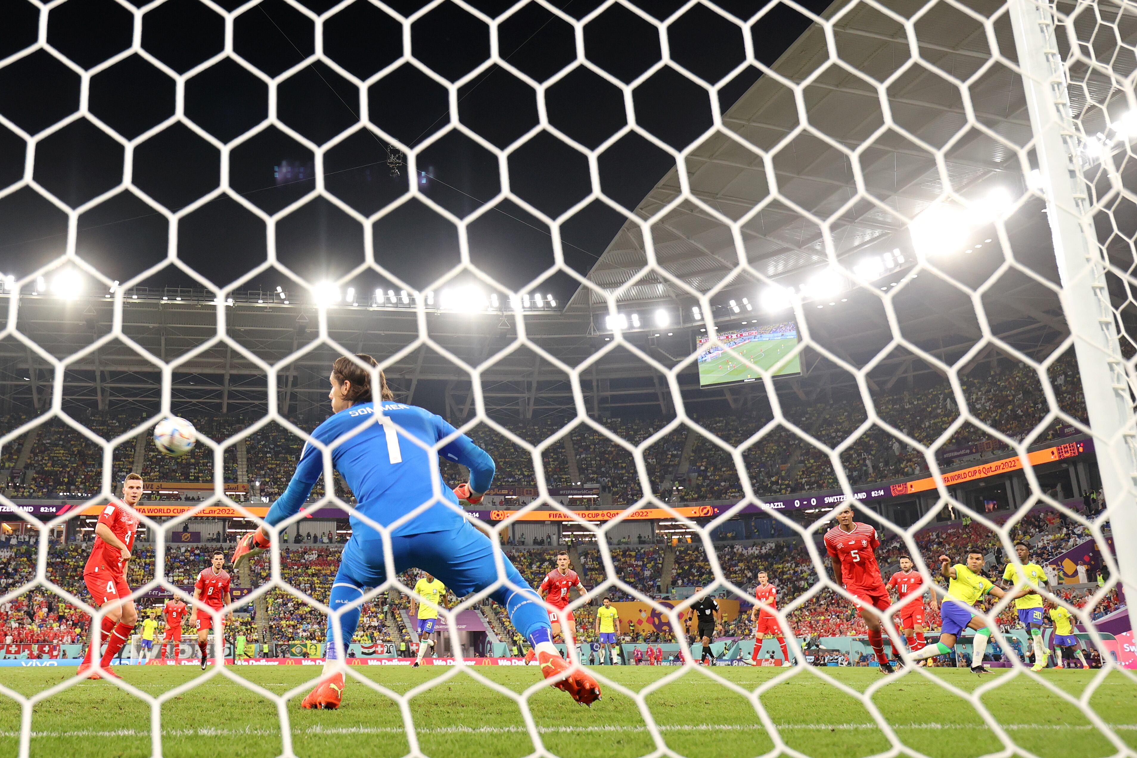 DOHA, QATAR - NOVEMBER 28: (EDITORS NOTE: In this photo taken from a remote camera from behind the goal) Casemiro of Brazil scores their team's first goal past Yann Sommer of Switzerland during the FIFA World Cup Qatar 2022 Group G match between Brazil and Switzerland at Stadium 974 on November 28, 2022 in Doha, Qatar. (Photo by Clive Brunskill/Getty Images)