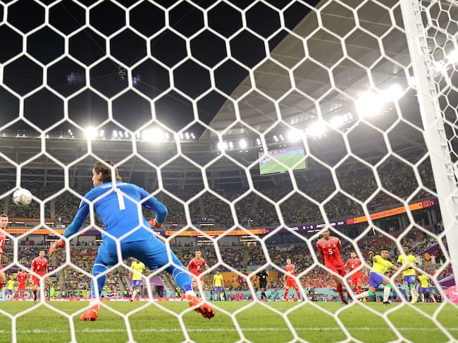 DOHA, QATAR - NOVEMBER 28: (EDITORS NOTE: In this photo taken from a remote camera from behind the goal) Casemiro of Brazil scores their team's first goal past Yann Sommer of Switzerland during the FIFA World Cup Qatar 2022 Group G match between Brazil and Switzerland at Stadium 974 on November 28, 2022 in Doha, Qatar. (Photo by Clive Brunskill/Getty Images)