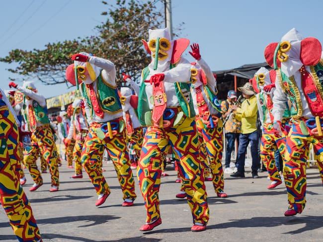 Colombians parade and dance during the &#039;Batalla de las Flores&#039; parade in Barranquilla, Colombia during the Carnival of Barranquilla on february 18, 2023. (Photo by: Roxana Charris/Long Visual Press/Universal Images Group via Getty Images)