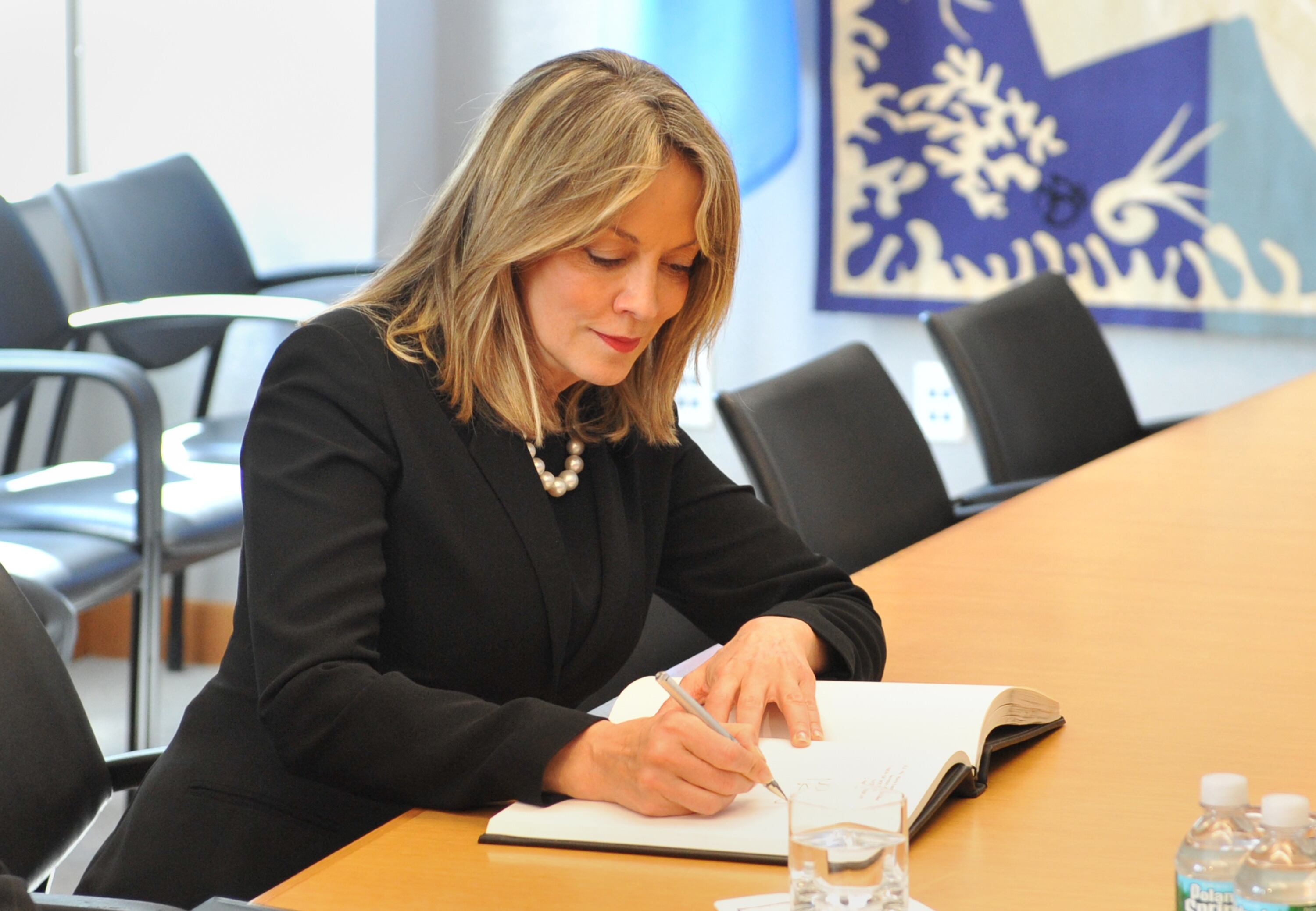 Maria Emma Mejia Vélez, Secretary-General, Union of South American Nations, signs a guest book just before her meeting with United Nations Secretary General Ban Ki-Moon April 2, 2012 at UN headquarters in New York. AFP PHOTO/Stan HONDA (Photo credit should read STAN HONDA/AFP via Getty Images)
