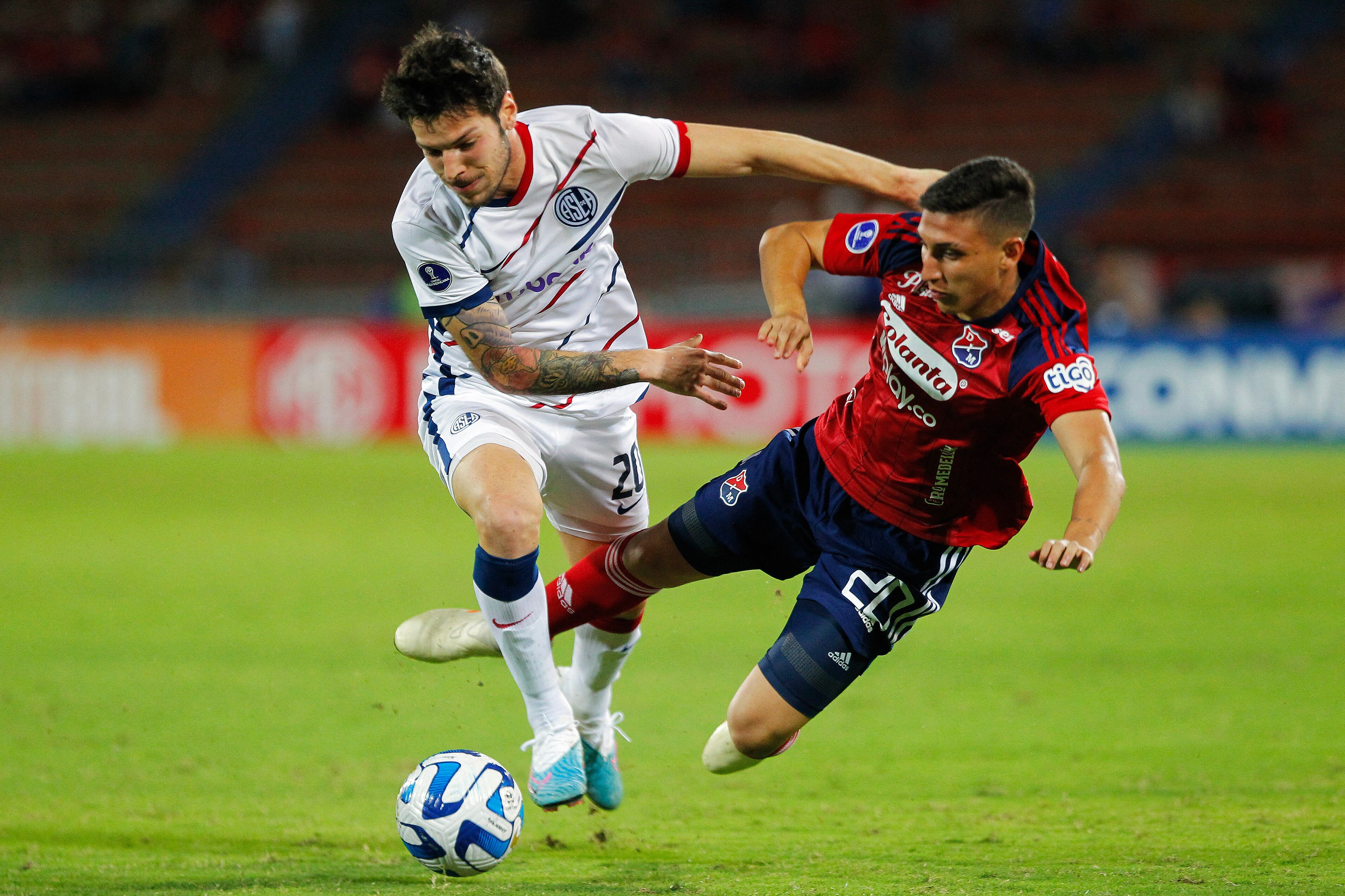 San Lorenzo's midfielder Agustin Martegani (L) and Independiente Medellin's midfielder Miguel Monsalve (R) fight for the ball during the Copa Sudamericana round of 32 knockout play-offs first leg football match between Colombia's Independiente Medellin and Argentina's San Lorenzo at the Atanasio Girardot stadium in Medellin, Colombia, on July 12, 2023. (Photo by Freddy BUILES / AFP) (Photo by FREDDY BUILES/AFP via Getty Images)