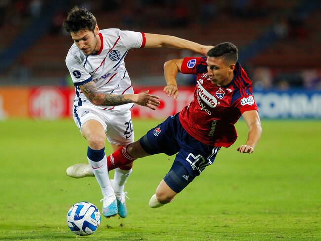 San Lorenzo's midfielder Agustin Martegani (L) and Independiente Medellin's midfielder Miguel Monsalve (R) fight for the ball during the Copa Sudamericana round of 32 knockout play-offs first leg football match between Colombia's Independiente Medellin and Argentina's San Lorenzo at the Atanasio Girardot stadium in Medellin, Colombia, on July 12, 2023. (Photo by Freddy BUILES / AFP) (Photo by FREDDY BUILES/AFP via Getty Images)