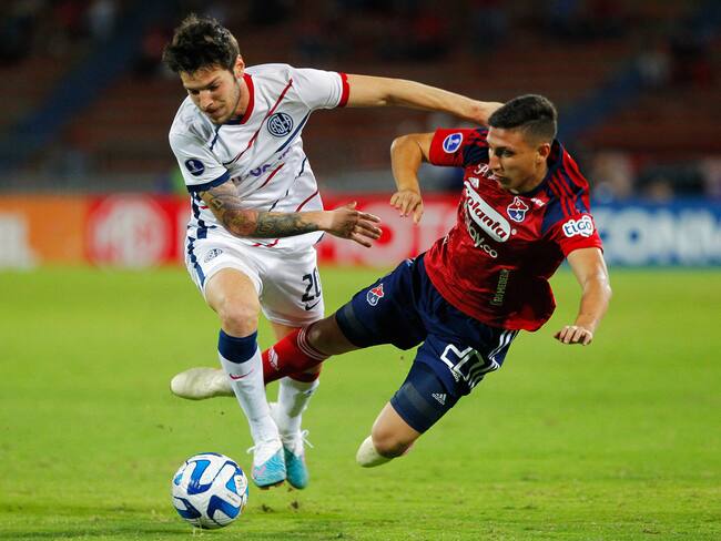 San Lorenzo's midfielder Agustin Martegani (L) and Independiente Medellin's midfielder Miguel Monsalve (R) fight for the ball during the Copa Sudamericana round of 32 knockout play-offs first leg football match between Colombia's Independiente Medellin and Argentina's San Lorenzo at the Atanasio Girardot stadium in Medellin, Colombia, on July 12, 2023. (Photo by Freddy BUILES / AFP) (Photo by FREDDY BUILES/AFP via Getty Images)