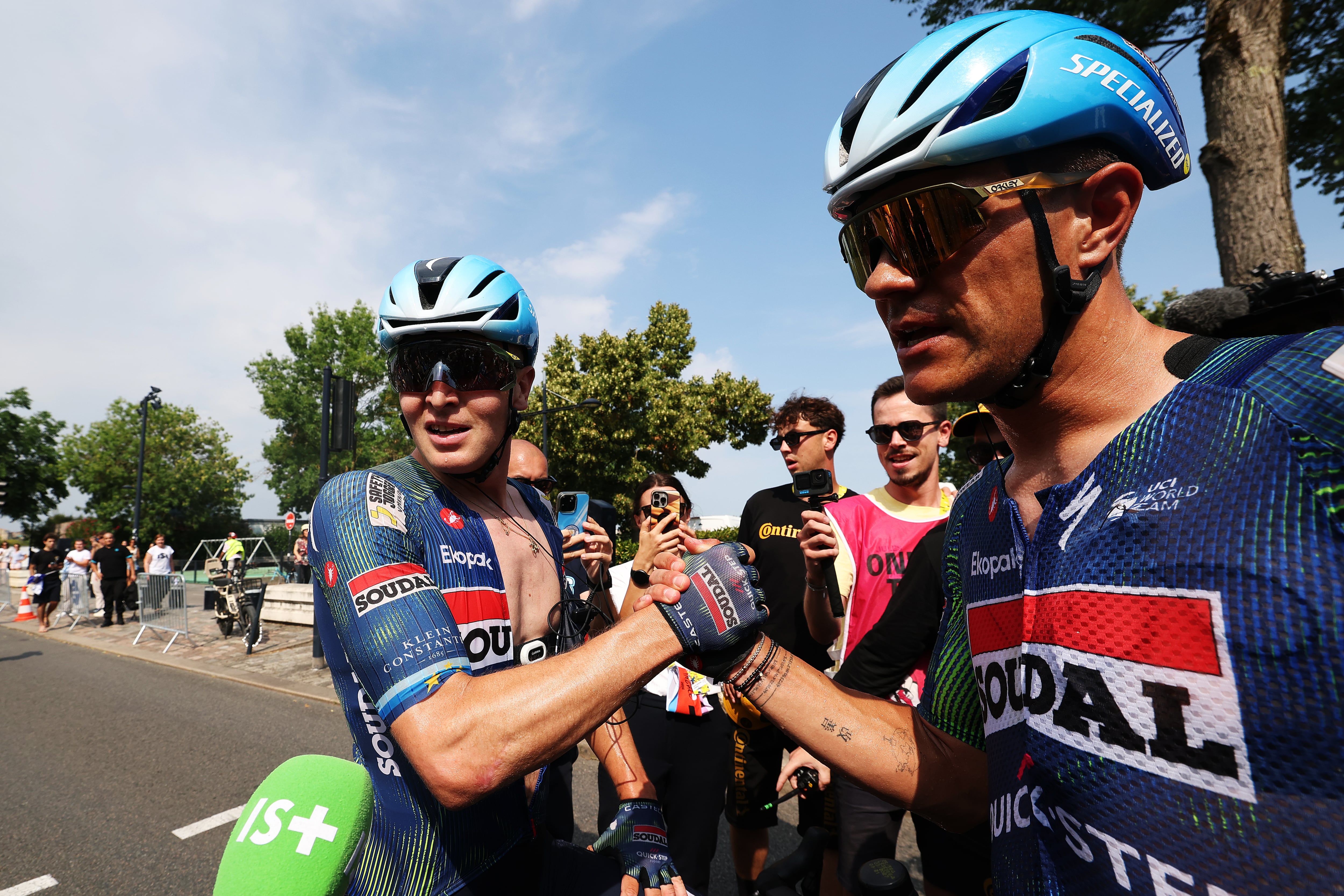 BORDEAUX, FRANCE - JULY 10: (L-R) Stage winner Tim Merlier of Belgium and Jasper Stuyven of Belgium and Team Soudal Quick-Step react after the 113th Tour de France 2026, Stage 7 a 175.1km stage from Hagetmau to Bordeaux / #UCIWT / on July 10, 2026 in Bordeaux, France. (Photo by Gonzalo Fuentes - Pool/Getty Images)