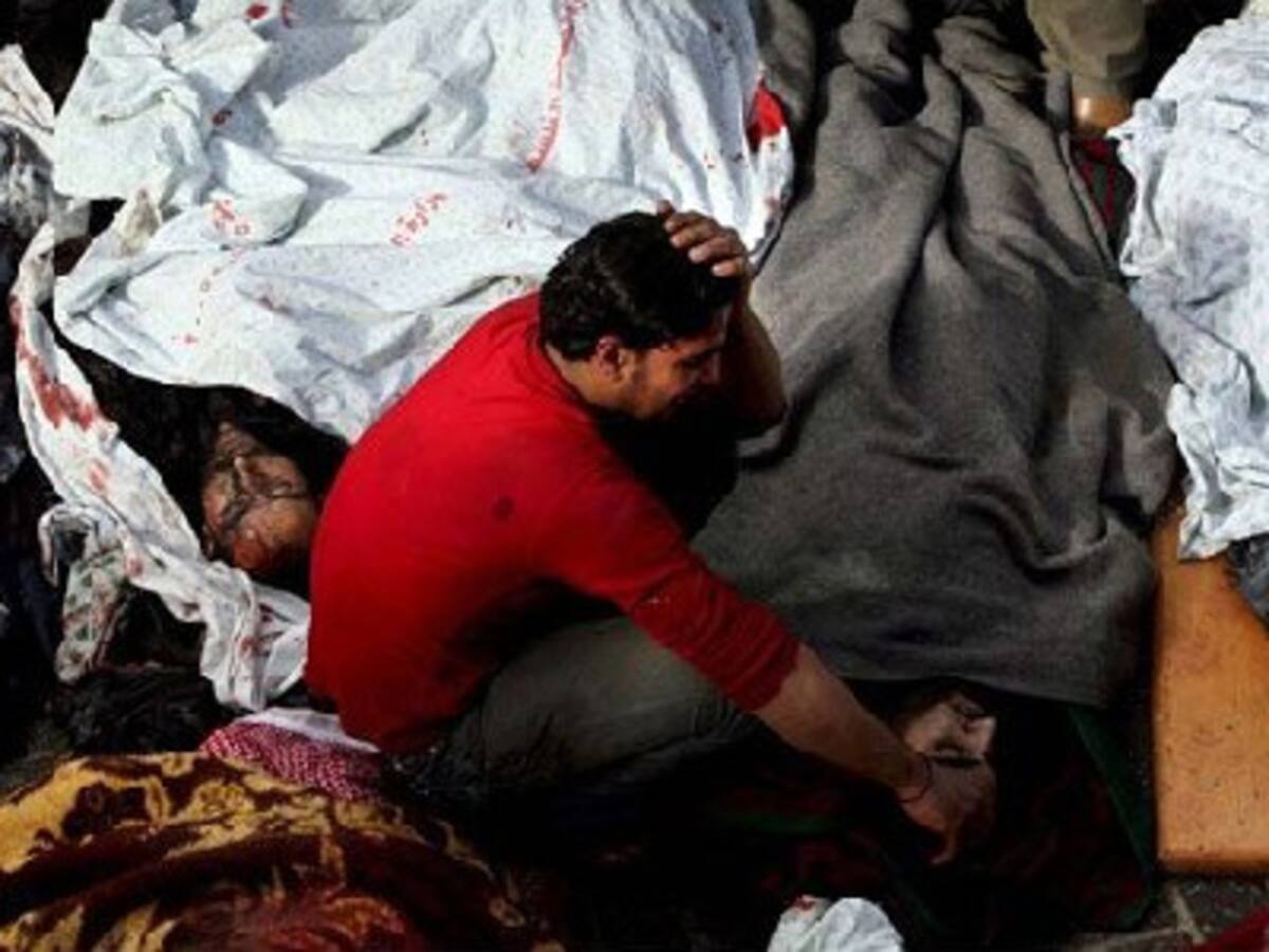 Joven llora los cuerpos EFE