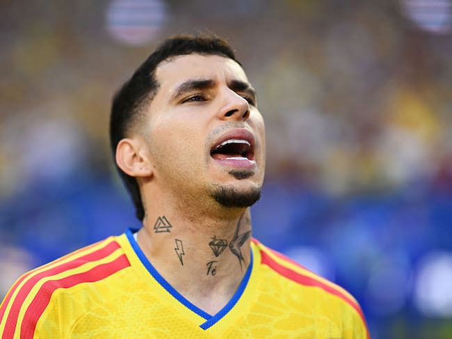 MIAMI GARDENS, FLORIDA - JUNE 27: Gustavo Puerta #14 of Colombia stands for the national anthem before the FIFA World Cup 2026 Group K match between Colombia and Portugal at Miami Stadium on June 27, 2026 in Miami Gardens, Florida. (Photo by Hannah Peters - FIFA/FIFA via Getty Images)