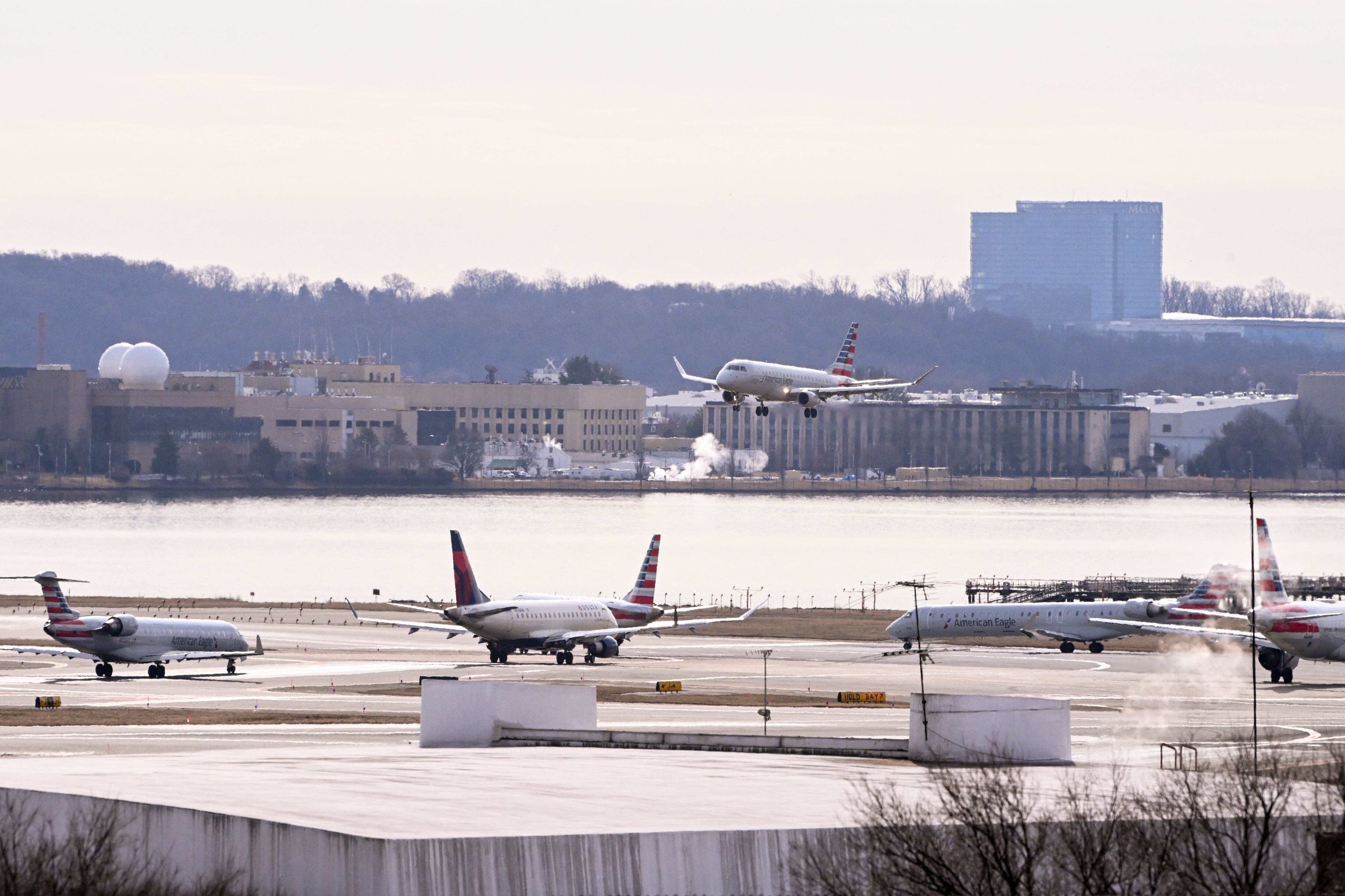 An American Airlines CRJ type plane approaches runway 1 at Ronald Reagan Washington National Airport (Photo by ROBERTO SCHMIDT / AFP)