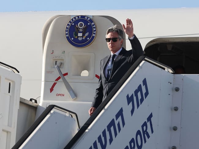 US Secretary of State Antony Blinken waves as he arrives at Ben Gurion airport near Tel Aviv, on June 10, 2024. - Blinken arrived in Israel as part of a regional tour to push for a much awaited Gaza ceasefire between Israel and Hamas. (Photo by JACK GUEZ / POOL / AFP)