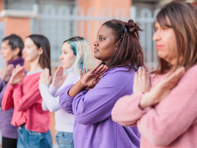 multicultural demonstration multiracial activism with Cuban, Spanish , Mexican Latin females. Hispanic colour of the tear trend for rights symbol