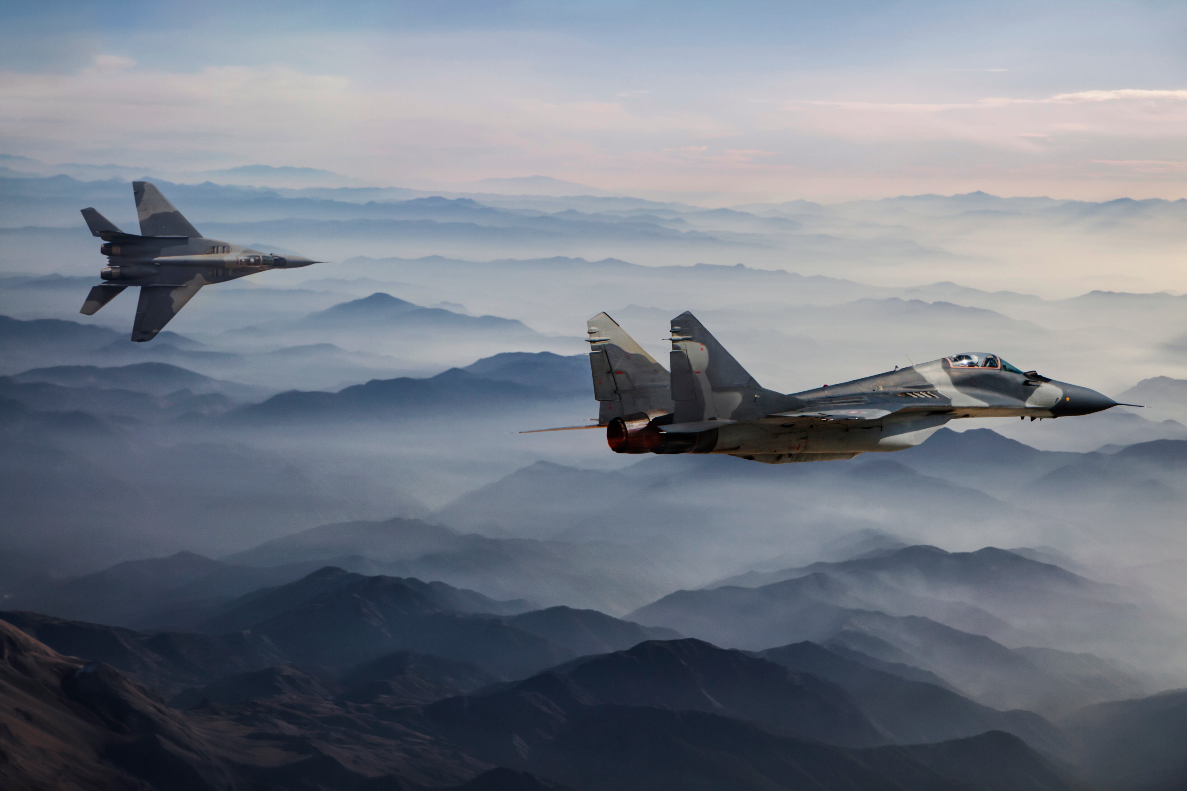 Fighter Jets in Flight above the fogy mountains