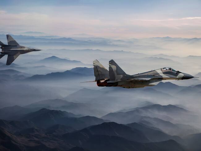 Fighter Jets in Flight above the fogy mountains