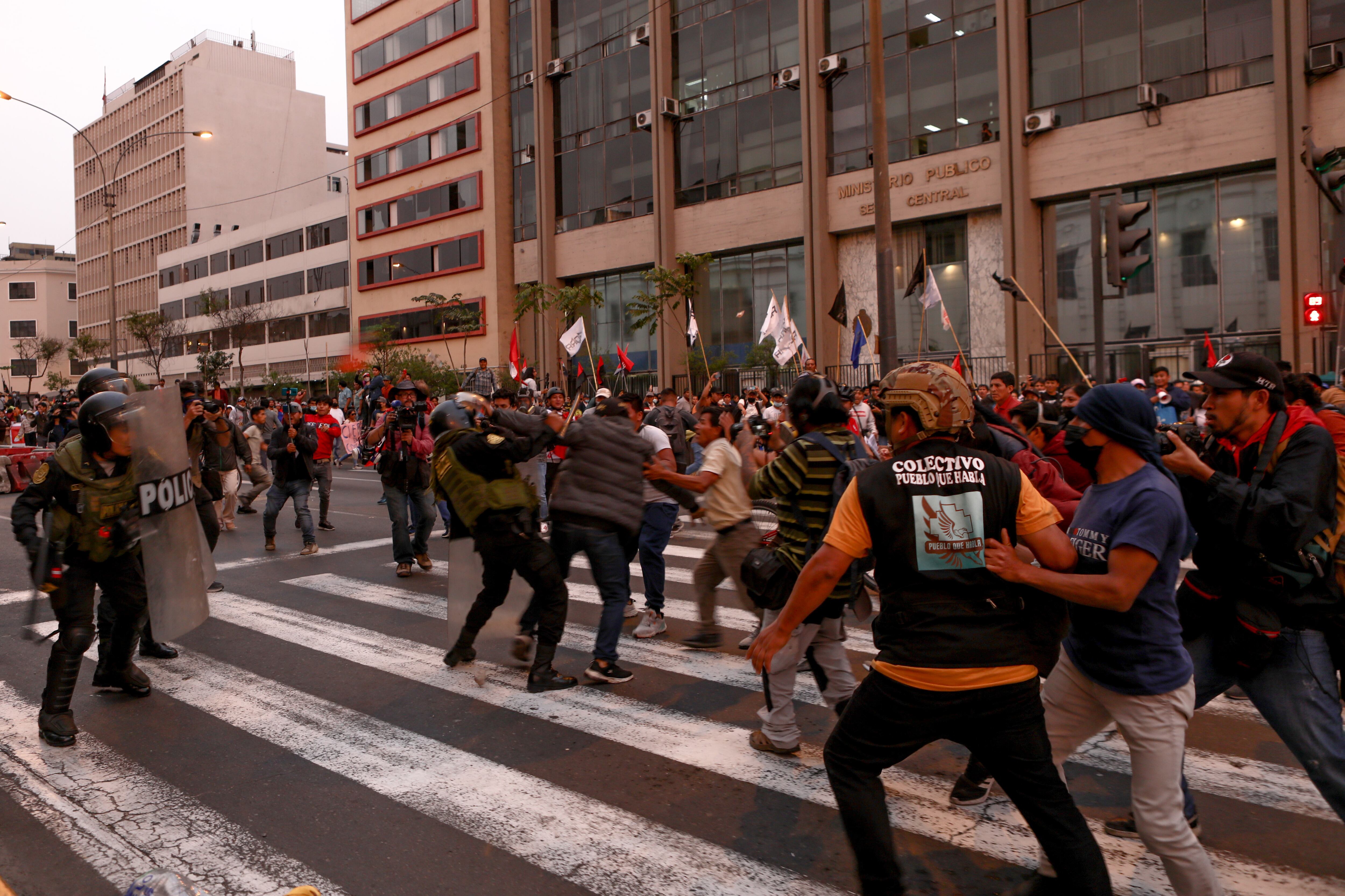 LIMA, PERU - Demonstrators clash with police during a protest demanding presidential elections, the release of Pedro Castillo and the closure of Congress after ousted Peruvian leader Pedro Castillo was detained in a police prison following his removal from office, in Lima, Peru, December 9, 2022 (Photo by Klebher Vasquez/Anadolu Agency via Getty Images)