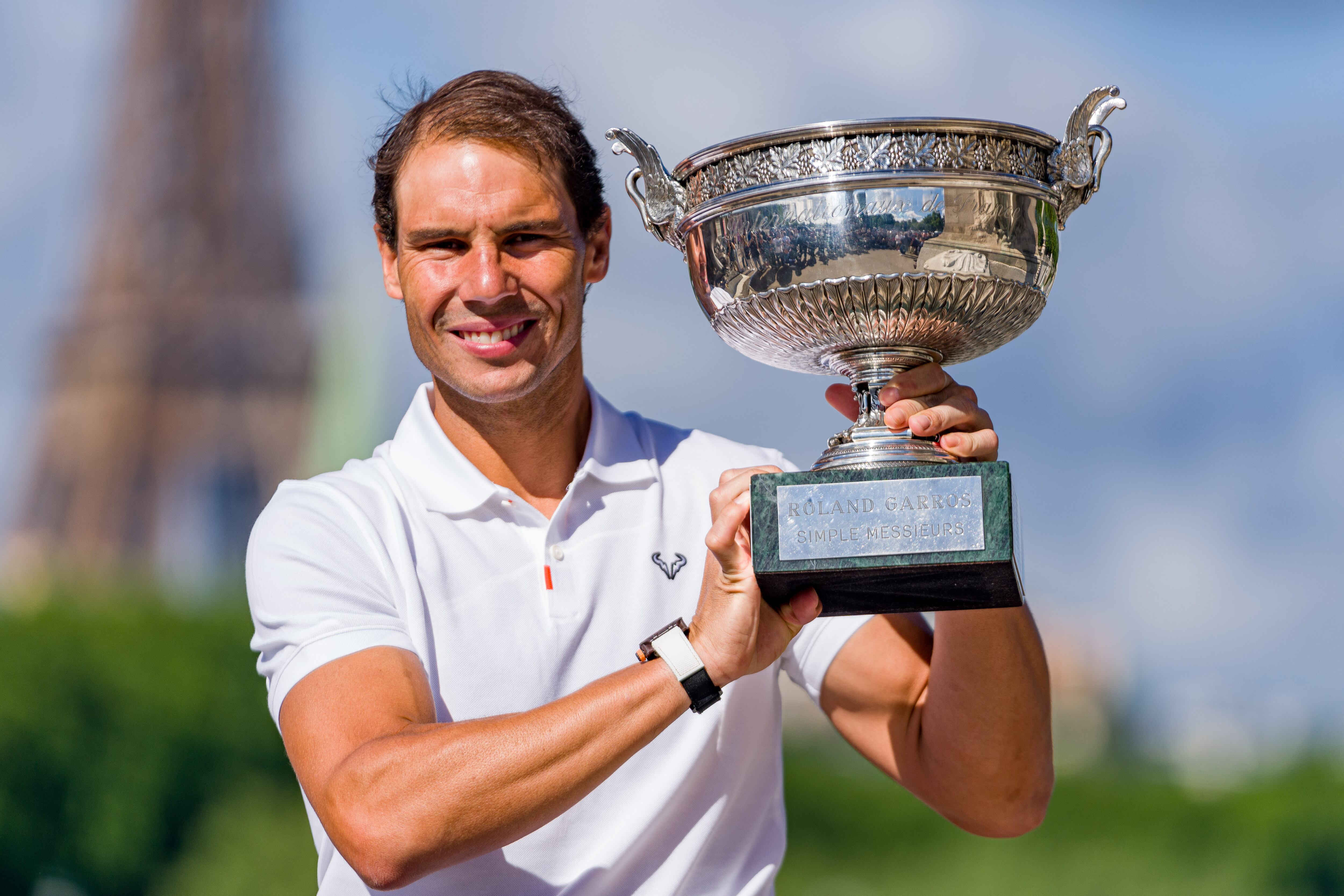 PARIS, FRANCE - JUNE 06: Rafael Nadal of Spain poses with the Musketeers Cup at the photocall after winning his 14th Roland Garros Grand Chelem title on Pont Alexandre III Bridge on June 06, 2022 in Paris, France. (Photo by Andy Cheung/Getty Images)