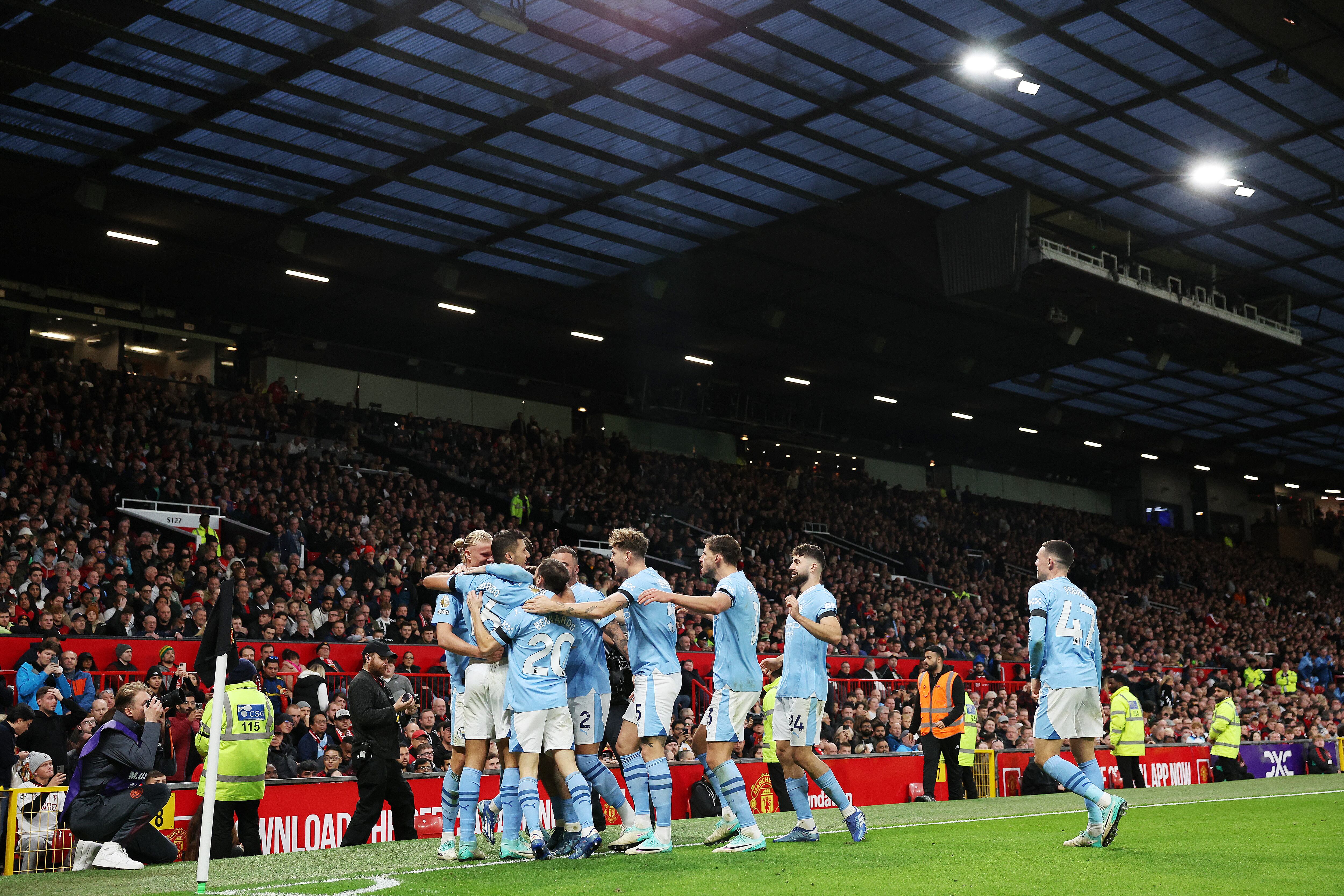 MANCHESTER, ENGLAND - OCTOBER 29: Erling Haaland of Manchester City celebrates with teammates after scoring the team's second goal during the Premier League match between Manchester United and Manchester City at Old Trafford on October 29, 2023 in Manchester, England. (Photo by Catherine Ivill/Getty Images)