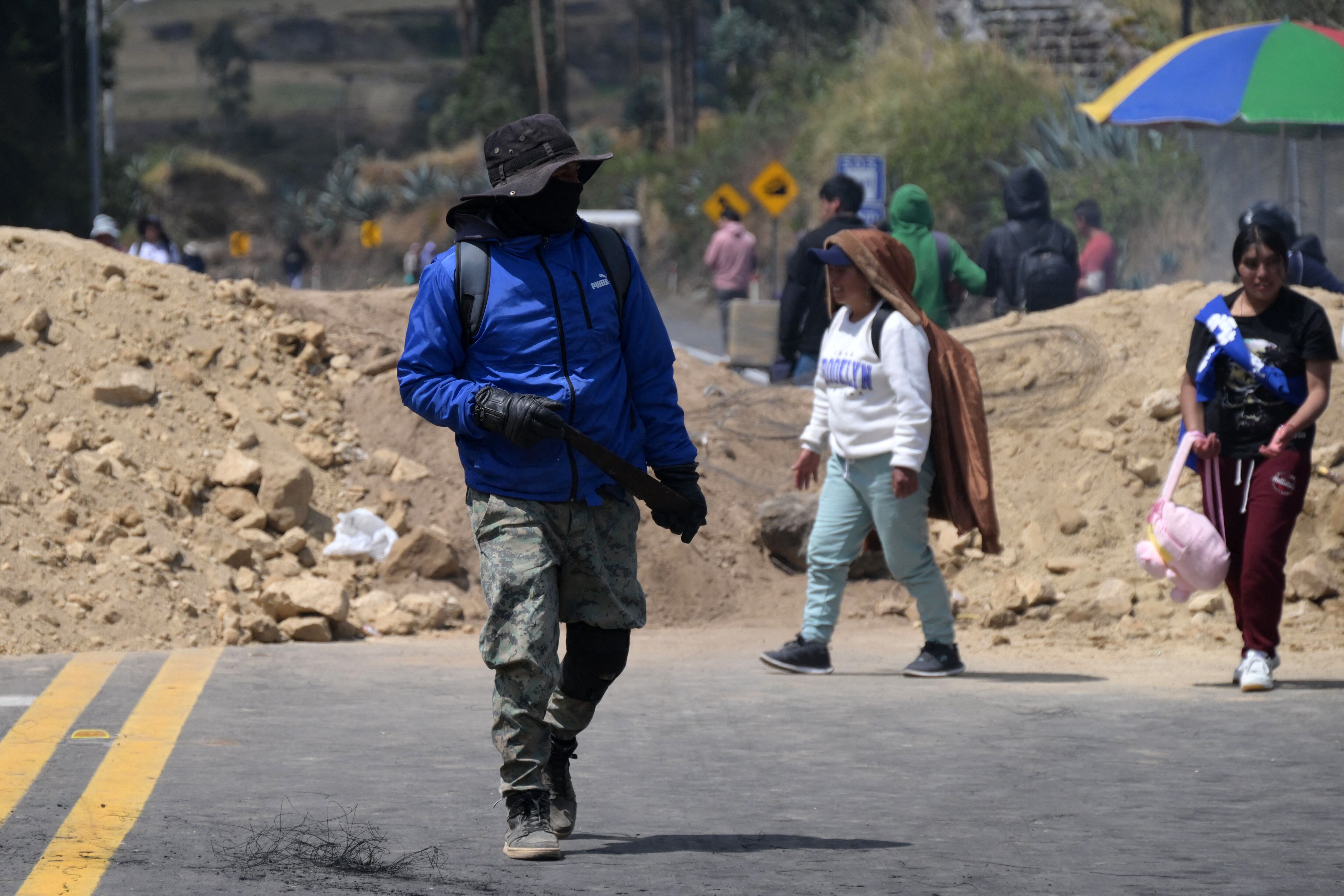 Indigenous people block the Pan-American Highway in the Guachala sector near Quito on September 22, 2025. Ecuador's largest indigenous organization (CONAIE) called for an "immediate and indefinite" national strike on September 22, 2025, to protest the elimination of the diesel subsidy which increased the price by 56 percent. (Photo by Rodrigo BUENDIA / AFP)