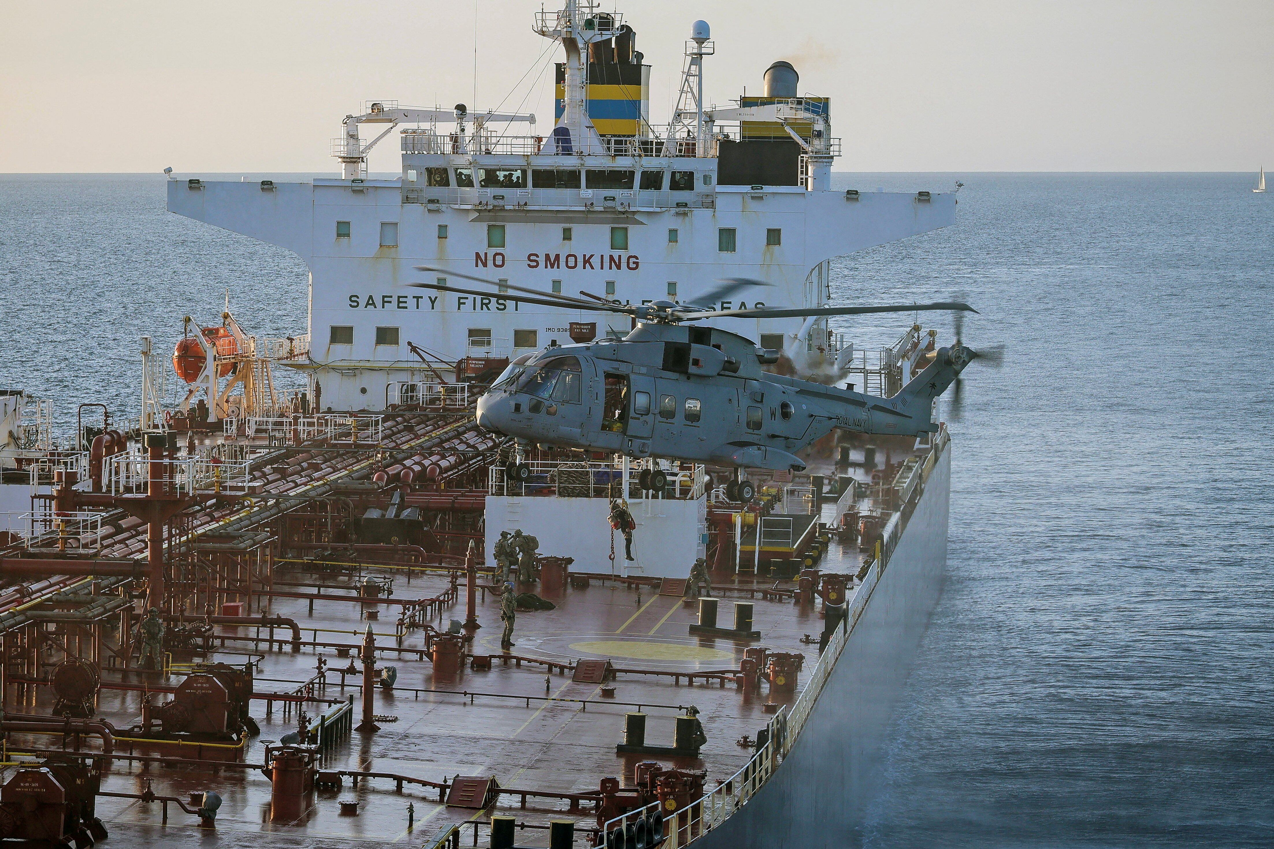 This handout picture taken on June 14, 2026 and released by the British Ministry of Defence (MOD) shows 42 Commando of the UK Commando force conducting maritime interdiction operations on the CMR Smyrtos sailing under a false Cameroonian flag, in the English Channel off the coast of the United Kingdom. British forces on June 14 intercepted a sanctioned oil tanker belonging to Russia's shadow fleet in the English Channel, the defence ministry said, in a six-hour operation hailed by Kyiv. (Photo by Ministry of Defence (United Kingdom) / AFP) / - NO Marketing campaign / -----EDITORS NOTE --- RESTRICTED TO EDITORIAL USE - MANDATORY CREDIT "AFP PHOTO / UK Ministry of Defence CROWN COPYRIGHT, 2026 " - NO MARKETING - NO ADVERTISING CAMPAIGNS - DISTRIBUTED AS A SERVICE TO CLIENTS - NO ARCHIVES - TO BE USED WITHIN 2 DAYS FROM JUNE 14, 2026 (48 HOURS), EXCEPT FOR MAGAZINES WHICH CAN PRINT THE PICTURE WHEN FIRST REPORTING ON THE EVENT /