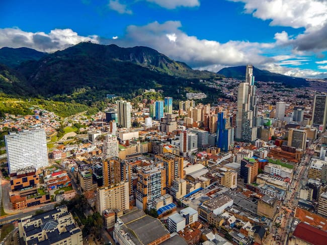 Bogota cityscape of big buildings and mountains and blue sky