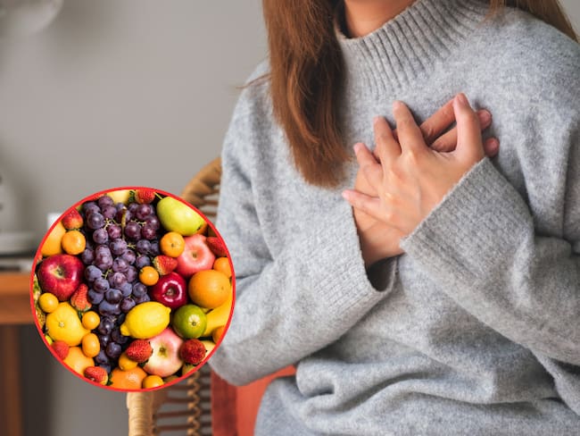 Mujer sintiendo un dolor en el pecho, cerca al corazón / Frutas (Getty Images)