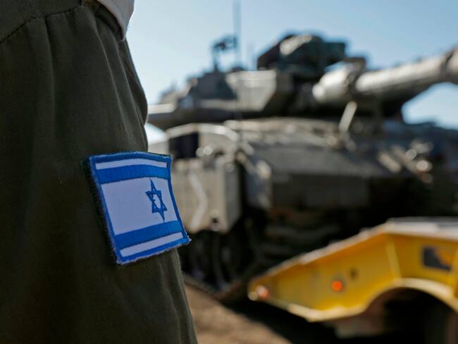 Israeli troops are pictured in the Israeli-annexed Golan Heights on the border with Syria on December 23, 2019. - A war monitor said today that air raids in Syria the previous night, blamed on Israel, killed at least three foreign pro-regime fighters south of the war-torn country's capital. The Britain-based Syrian Observatory for Human Rights said Sunday night's attack hit Syrian regime and Iranian positions south of Damascus. It said three non-Syrian loyalist fighters were killed by a rocket blast between the suburb of Aqraba and the nearby Sayyida Zeinab neighbourhood, home to a shrine revered by Shiite Muslims. (Photo by JALAA MAREY / AFP) (Photo by JALAA MAREY/AFP via Getty Images)