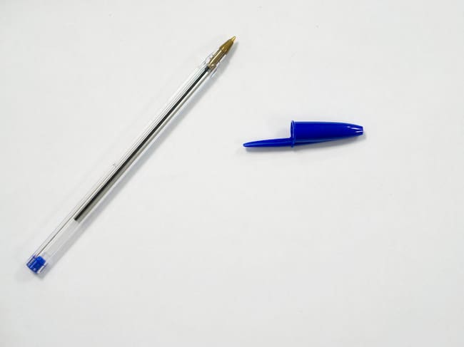 blue pen on white background