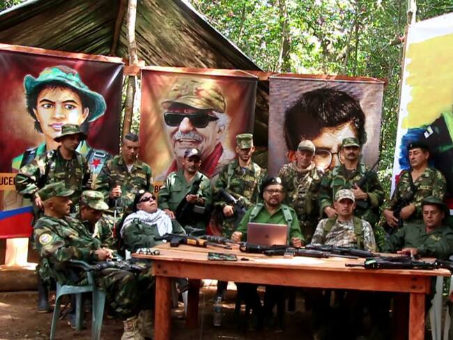This TV grab taken from youtube and released on Septmber 4, 2019 shows former senior commanders of the dissolved FARC rebel army group in Colombia, Ivan Marquez(C) and fugitive rebel colleague, Jesus Santrich (wearing sunglasses), on an undisclosed location announcing the creation of a clandestine political organization that will seek to &quot;eradicate corruption&quot; and to form a social base that defends the group&#039;s politics. (Photo by - / various sources / AFP)        (Photo credit should read -/AFP via Getty Images)