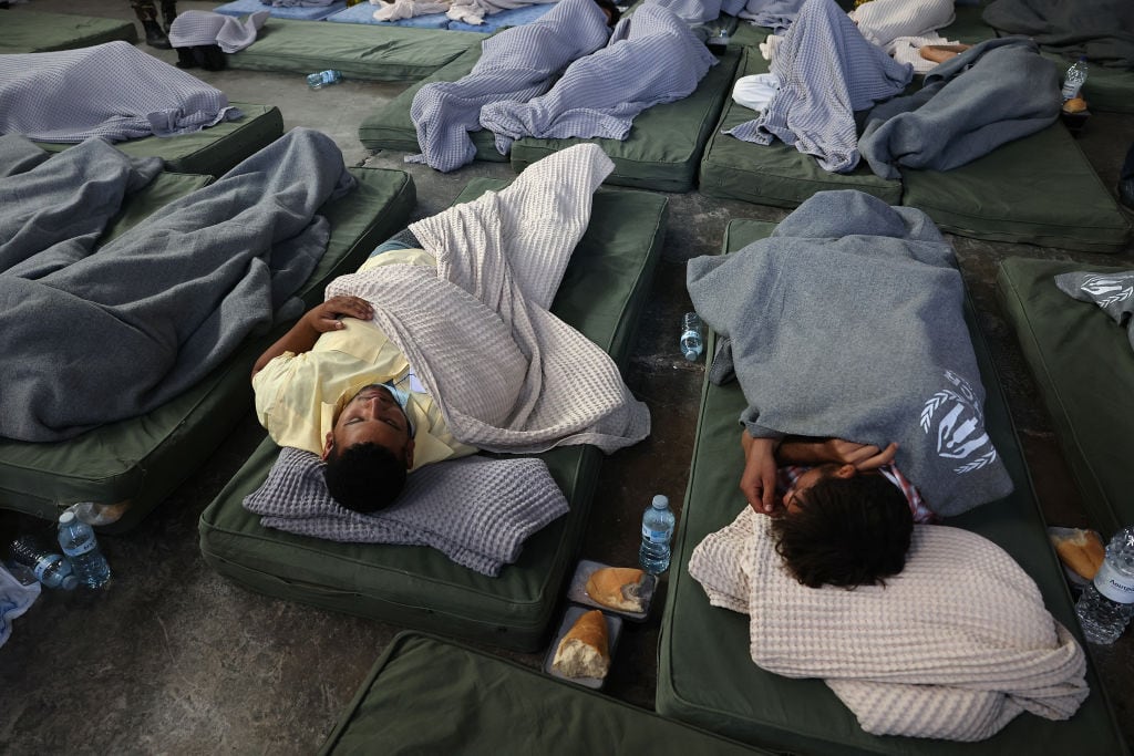 KALAMATA, GREECE - JUNE 14: Rescued migrants find shelter at a depot, following a shipwreck off shore in Kalamata , Greece on June 14, 2023 (Photo by Costas Baltas/Anadolu Agency via Getty Images)