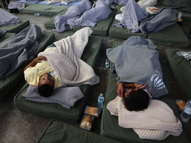 KALAMATA, GREECE - JUNE 14: Rescued migrants find shelter at a depot, following a shipwreck off shore in Kalamata , Greece on June 14, 2023 (Photo by Costas Baltas/Anadolu Agency via Getty Images)