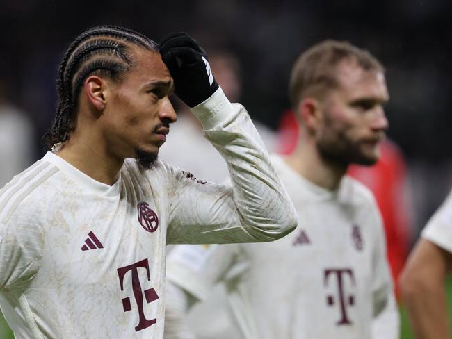 Bayern Munich&#039;s German forward #10 Leroy Sane (L) reacts after the German first division Bundesliga football match between Eintracht Frankfurt and FC Bayern Munich in Frankfurt, western Germany on December 9, 2023. (Photo by Daniel ROLAND / AFP) / DFL REGULATIONS PROHIBIT ANY USE OF PHOTOGRAPHS AS IMAGE SEQUENCES AND/OR QUASI-VIDEO (Photo by DANIEL ROLAND/AFP via Getty Images)