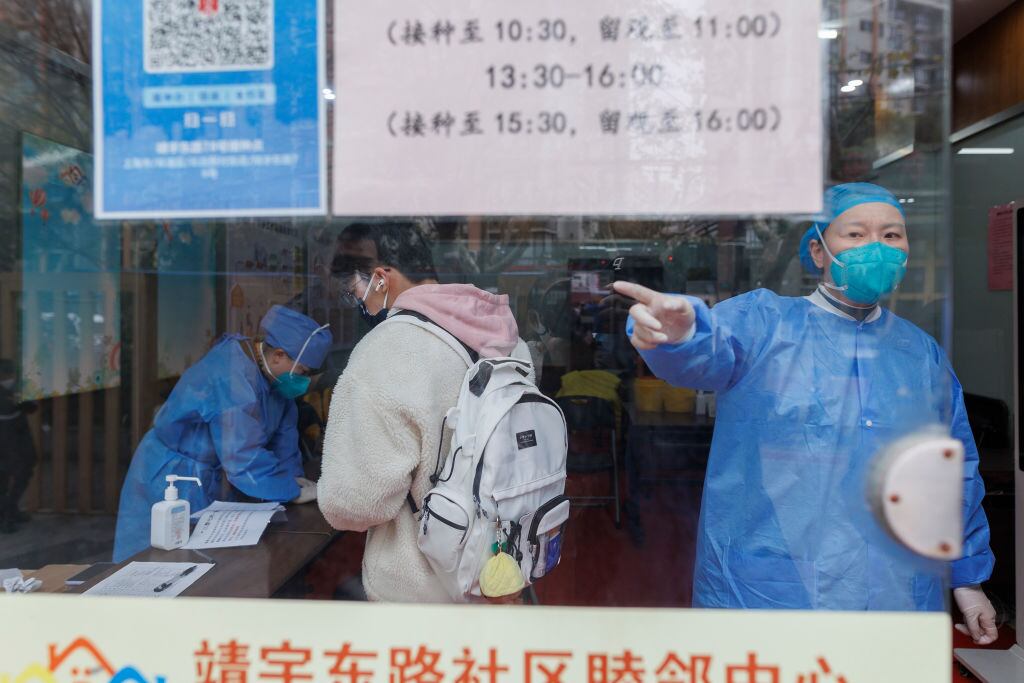 SHANGHAI, CHINA - DECEMBER 07: A man registers for COVID-19 vaccination at a community center  on December 07, 2022 in Shanghai, China. (Photo by Hugo Hu/Getty Images)