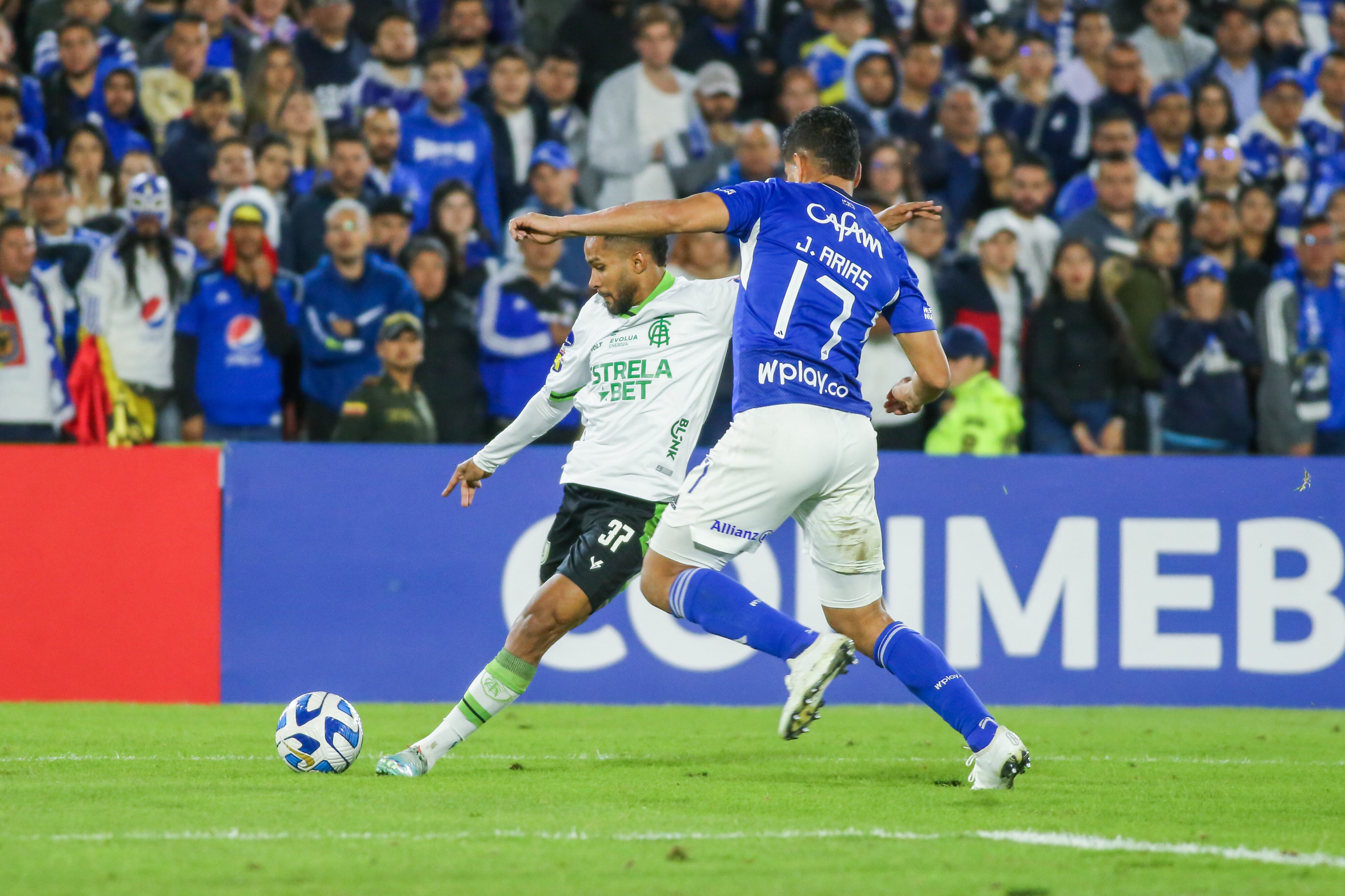 Jorge Arias of Millonarios (COL) and Everaldo of America F. C. (BRA) fight for the ball in the match between Millonarios F. C. (COL) and America F. C. (BRA) of the group stage date 3 of group F between Millonarios F. C. (COL) and America F. C. (BRA) for the CONMEBOL South American Cup 2023 at the Nemesio Camacho El Campin stadium in the city of Bogota.  (Photo by Daniel Garzon Herazo/NurPhoto via Getty Images)